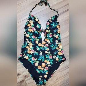 Womens one piece. Fruit/black